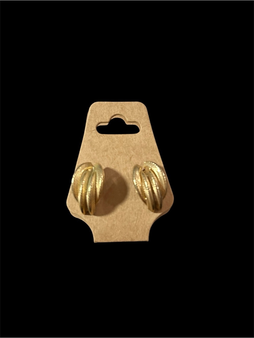 Gold-toned vintage knot stud earrings feature a textured, shrimp braided design